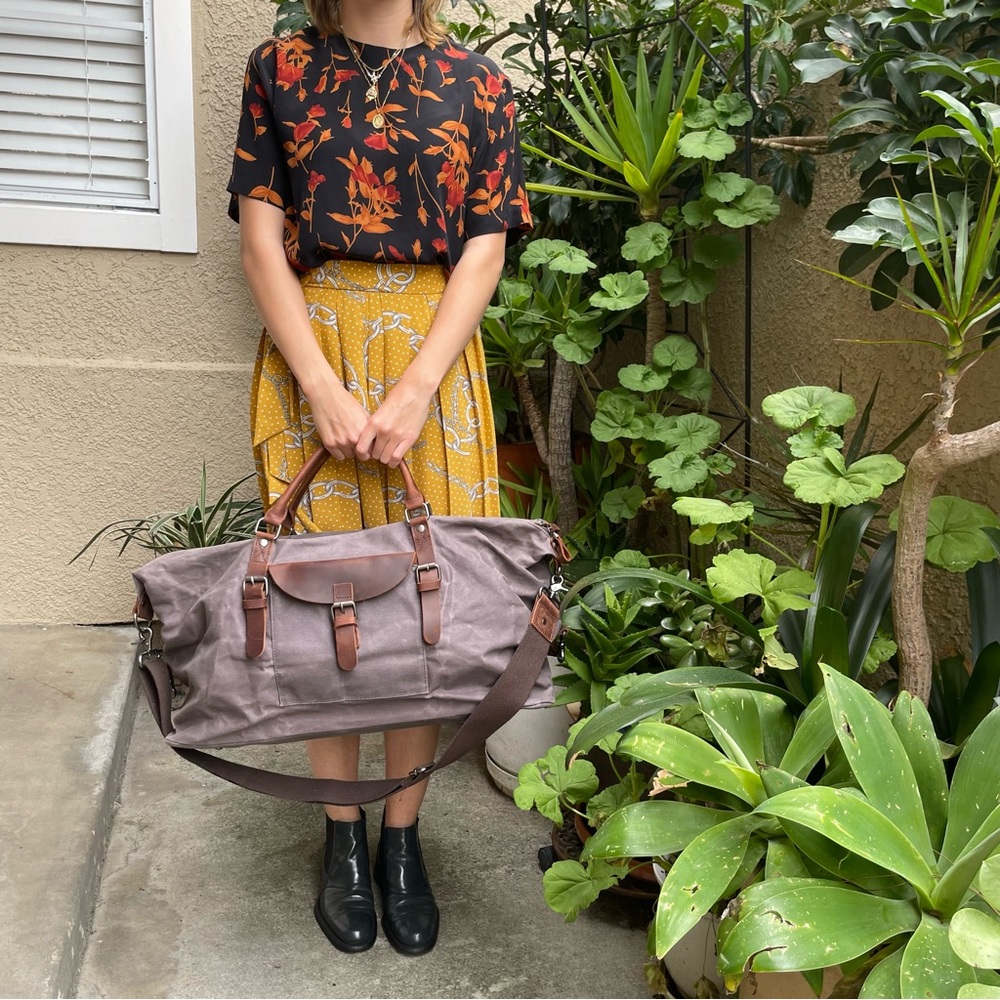 Grayish brown cotton/leather travel bag